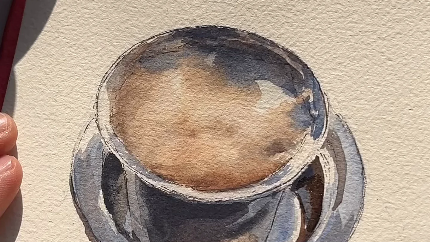 A steel filter coffee part-way through painting, seen from above