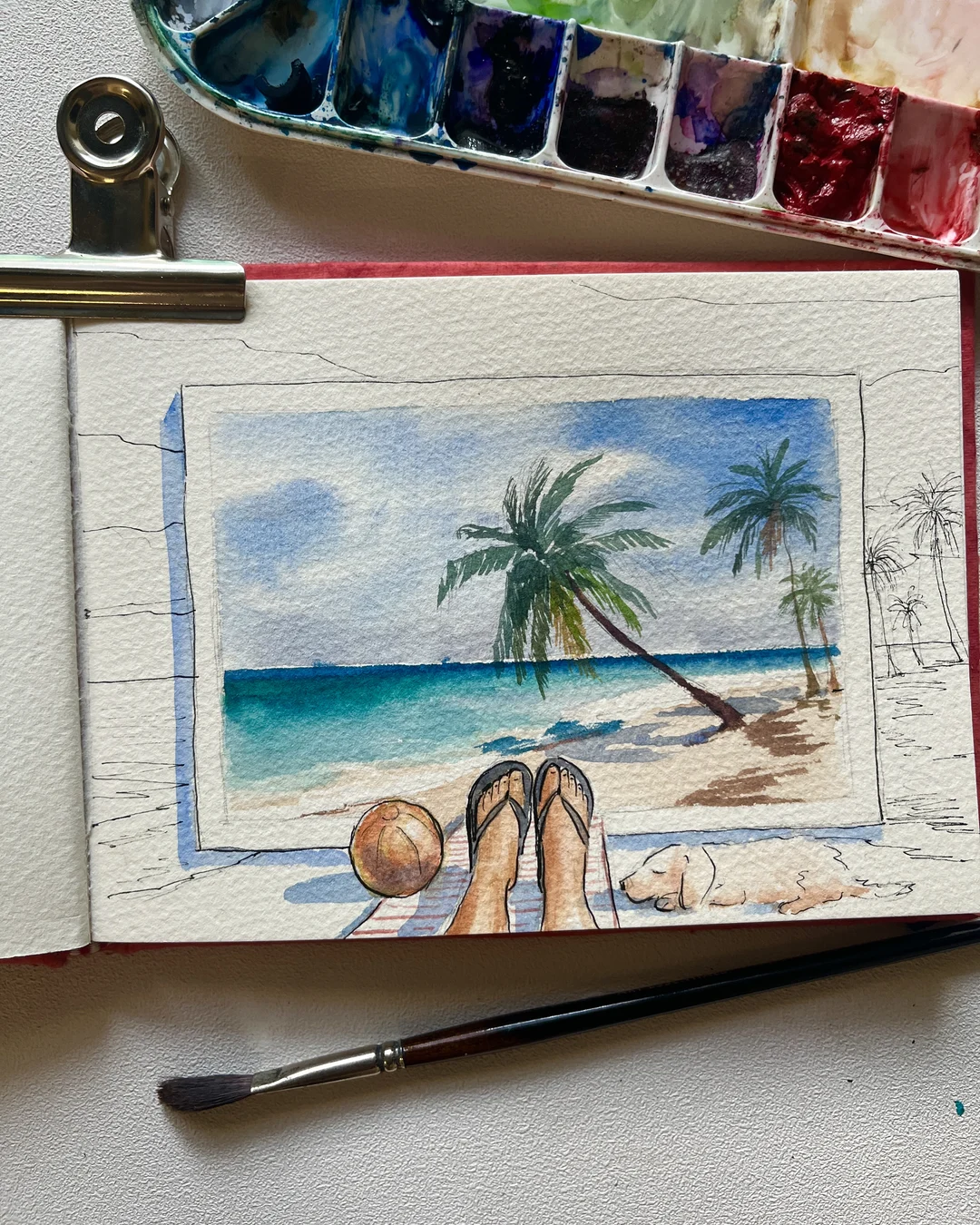 A beach landscape in watercolour, painted as a postcard, with a sleeping dog in pen